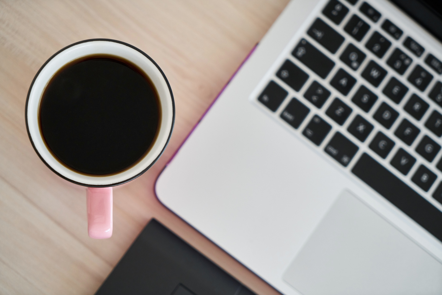 Macbook Pro Beside Pink Mug